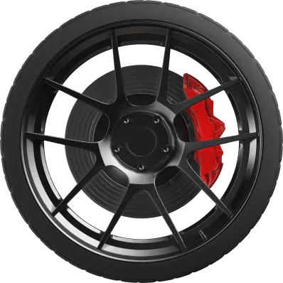 Close-up of a matte black multi-spoke alloy wheel with a high-performance red brake caliper and ventilated disc rotor.